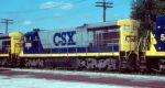 CSX 3125 passes on a freight